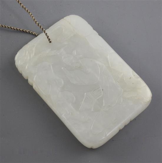 A Chinese white jade plaque, 19th century, 6cm